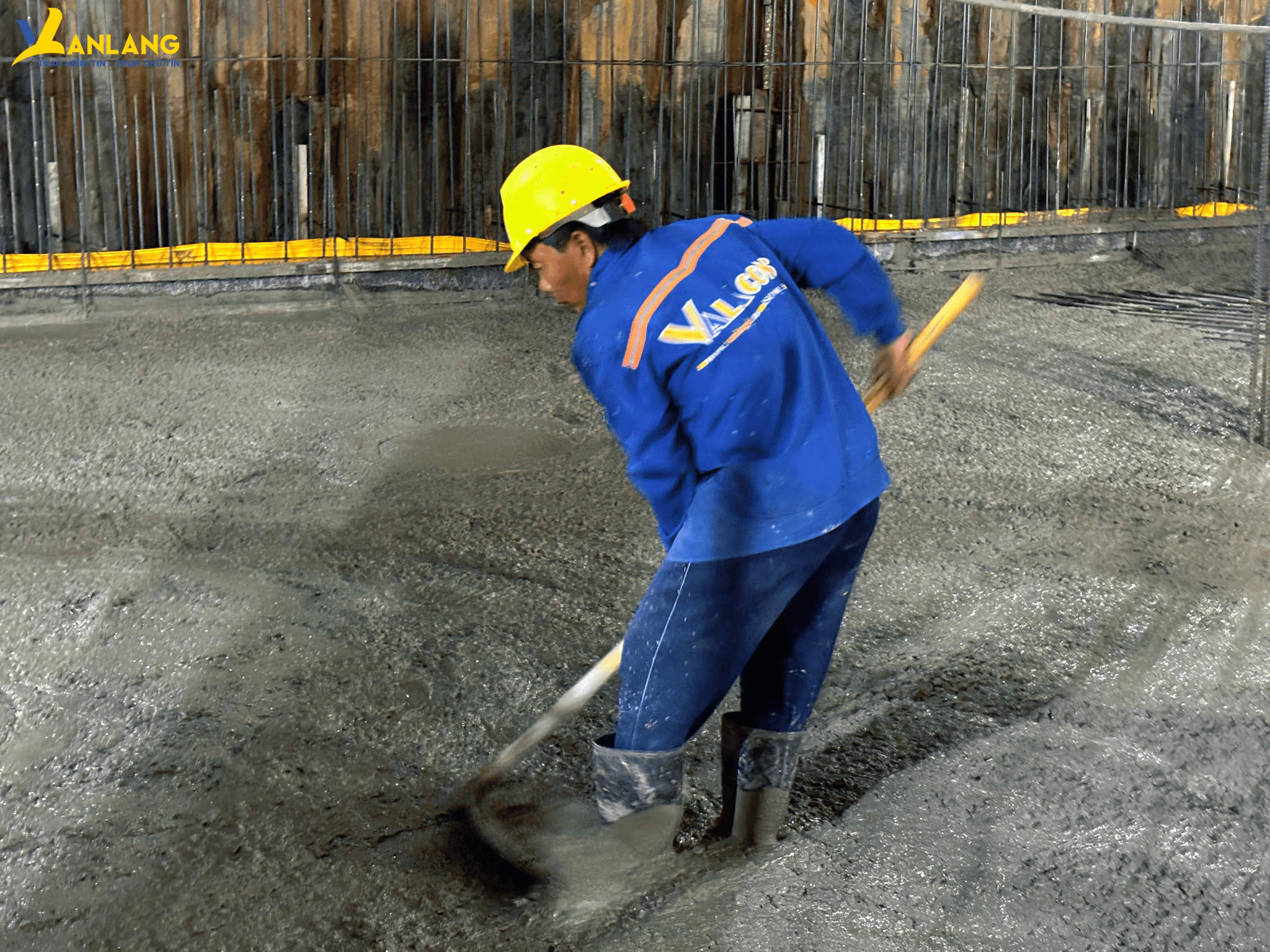 Workers laboring through the night, silently building each layer of concrete as if constructing solid dreams for future generations.